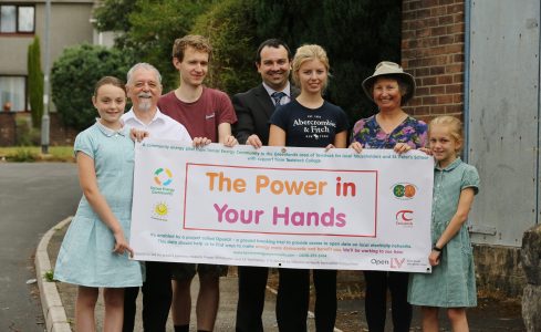 The Power in Your Hands team with banner